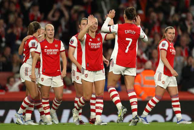 Caitlin Foord, centre, hit a late double as Arsenal beat Tottenham in the Women’s Super League (Bradley Collyer/PA)