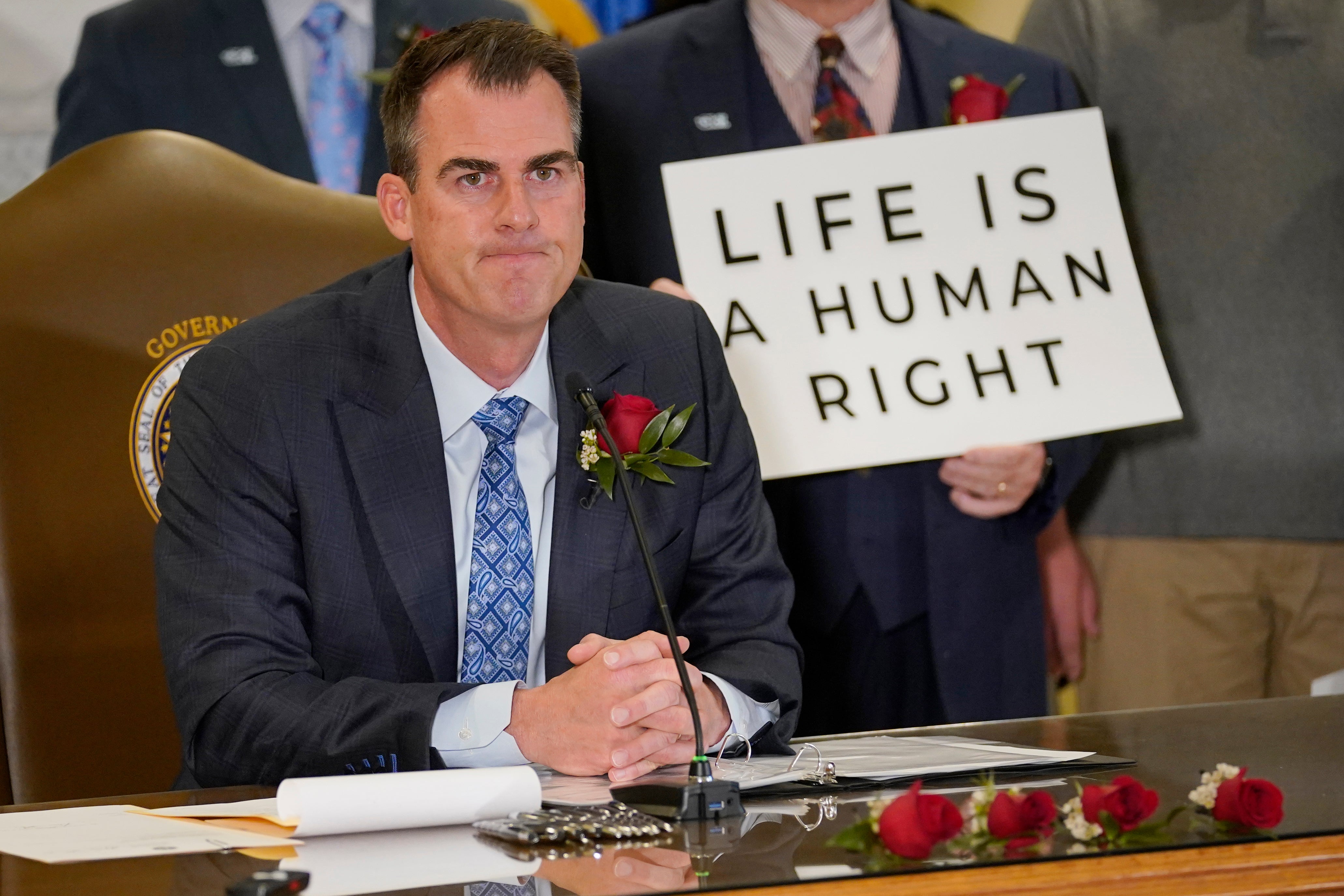Oklahoma Governor Kevin Stitt is pictured signing legislation making abortion care a felony in April 2022, weeks before the US Supreme Court overturned Roe v Wade