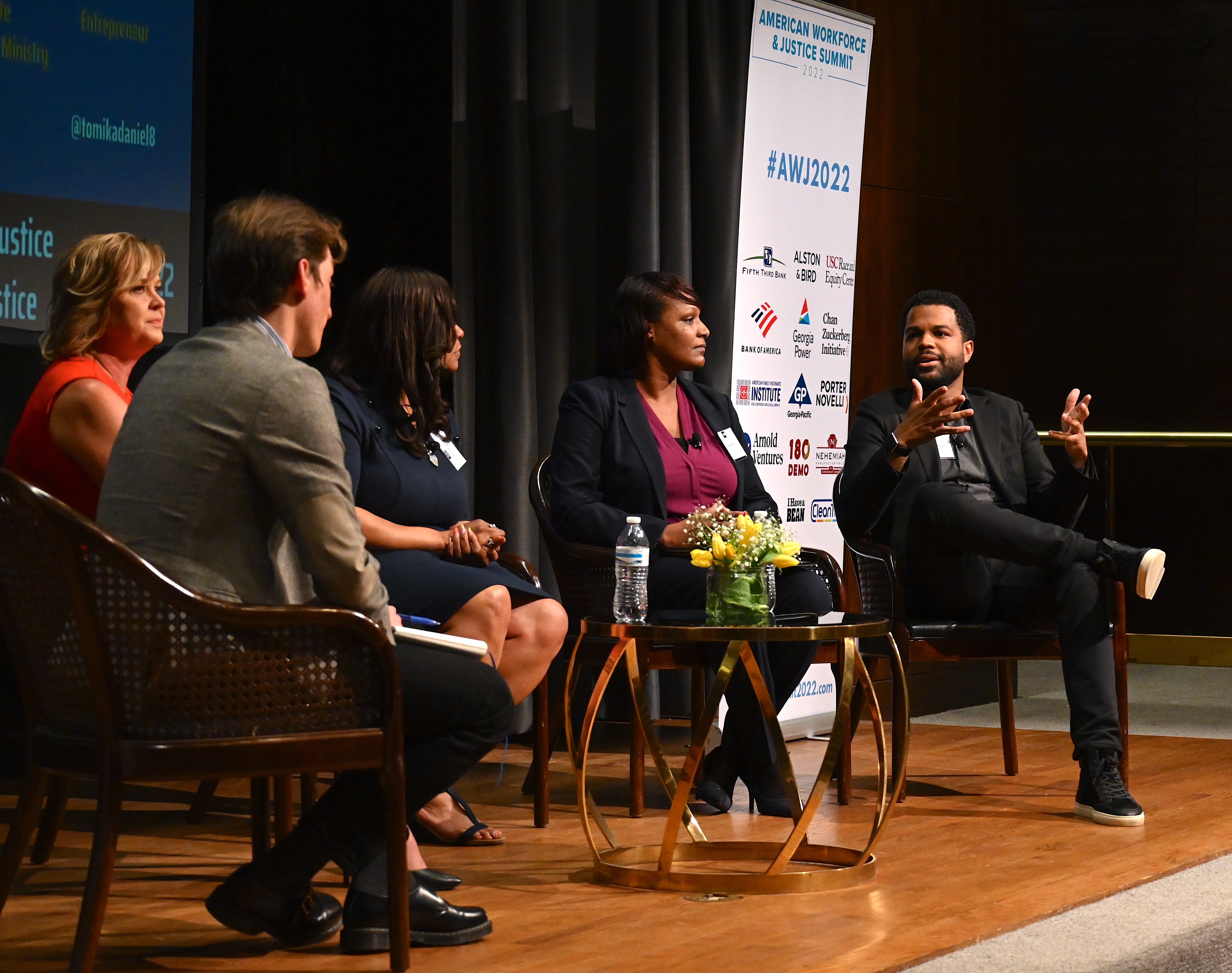 Josh Marcus of The Independent , Michelle Cirocco of Televerde, Tomika Daniel of Bailees Logistics, Malika Kidd of Lutheran Metropolitan Ministries, and Daniel Forkkio of Represent Justice on a panel discussion at the American Workforce and Justice Summit