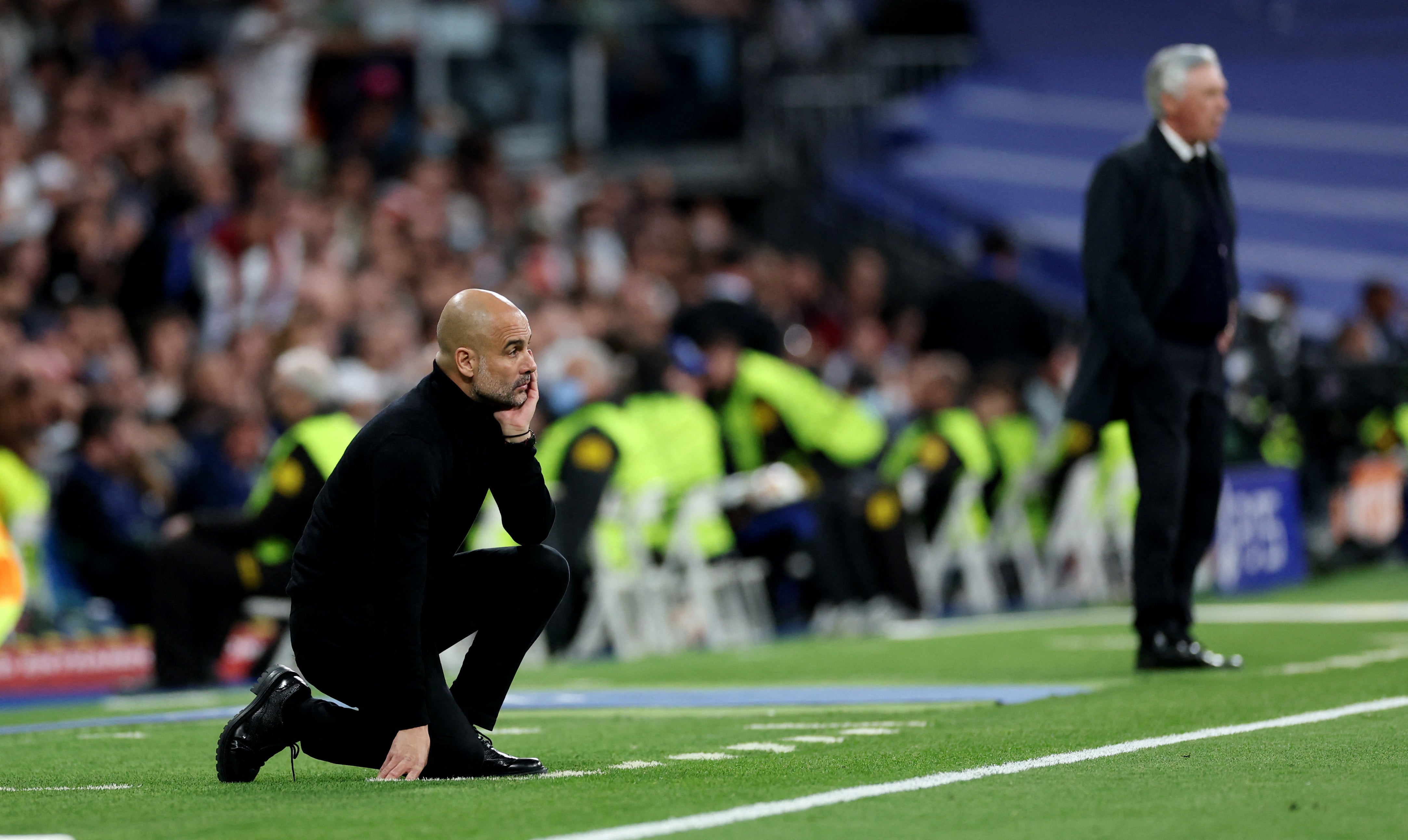 Pep Guardiola watches on at the Bernabeu