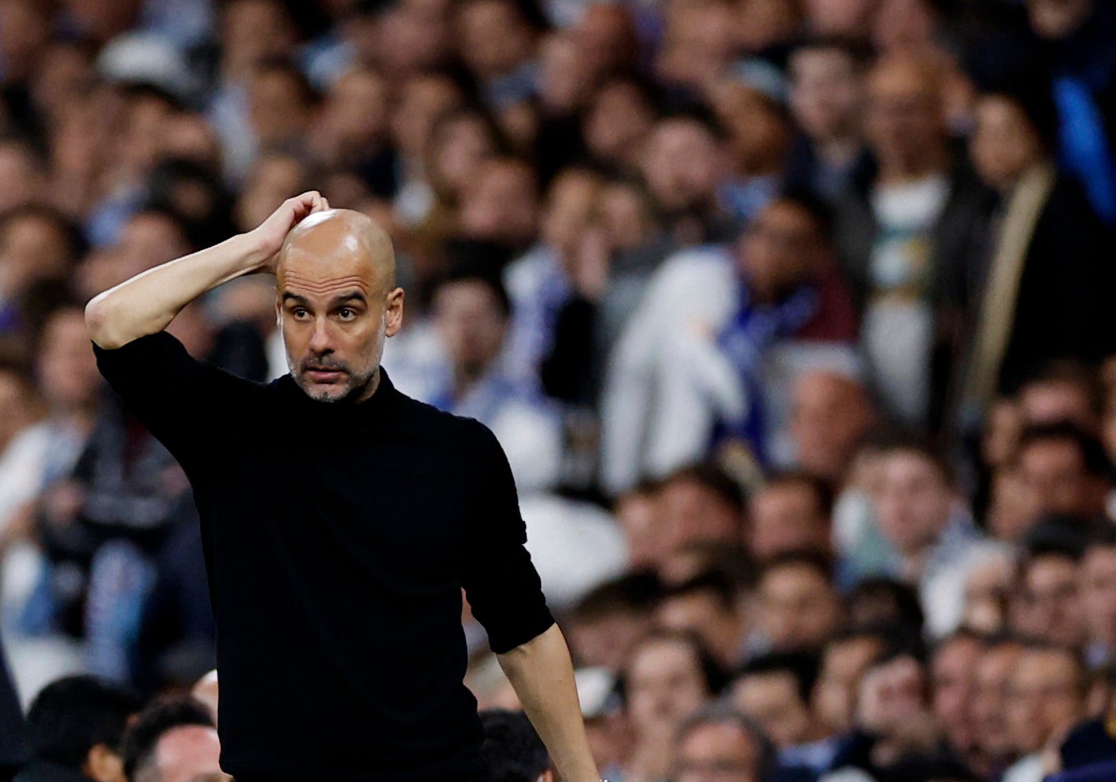 Pep Guardiola looks dejected during the second leg of the Champions League semi-final