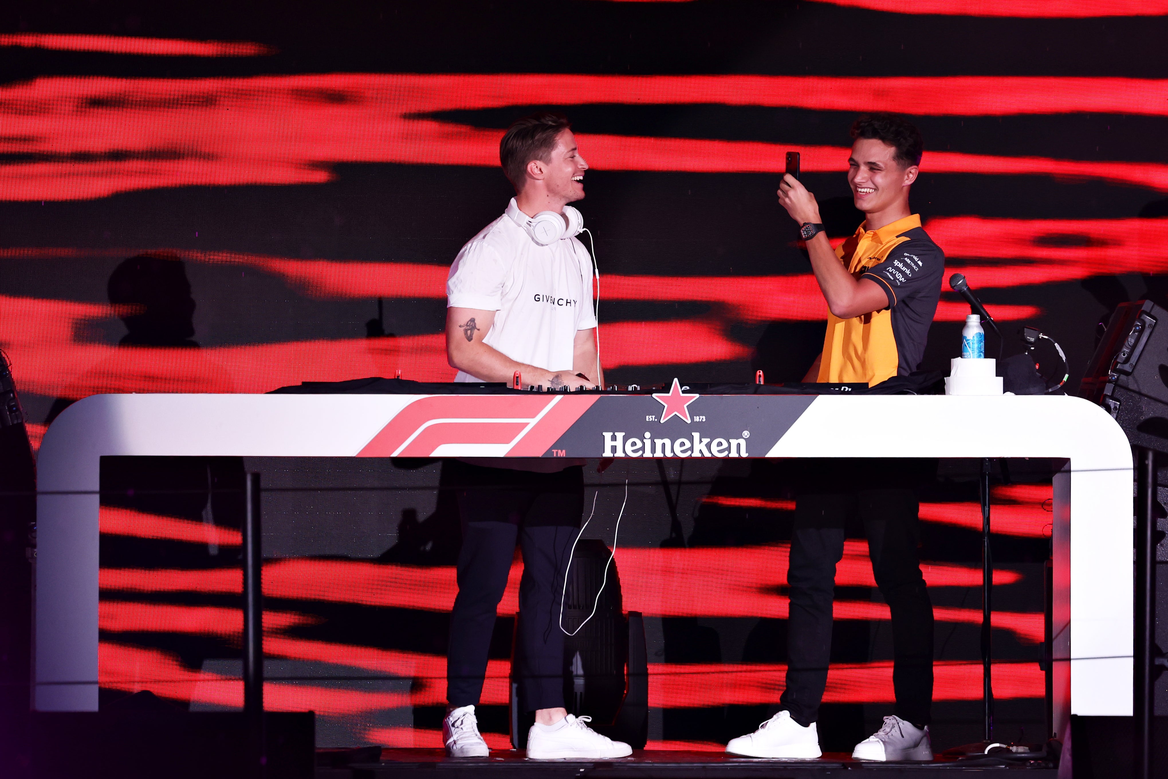 Kygo and Lando Norris perform on stage in Miami