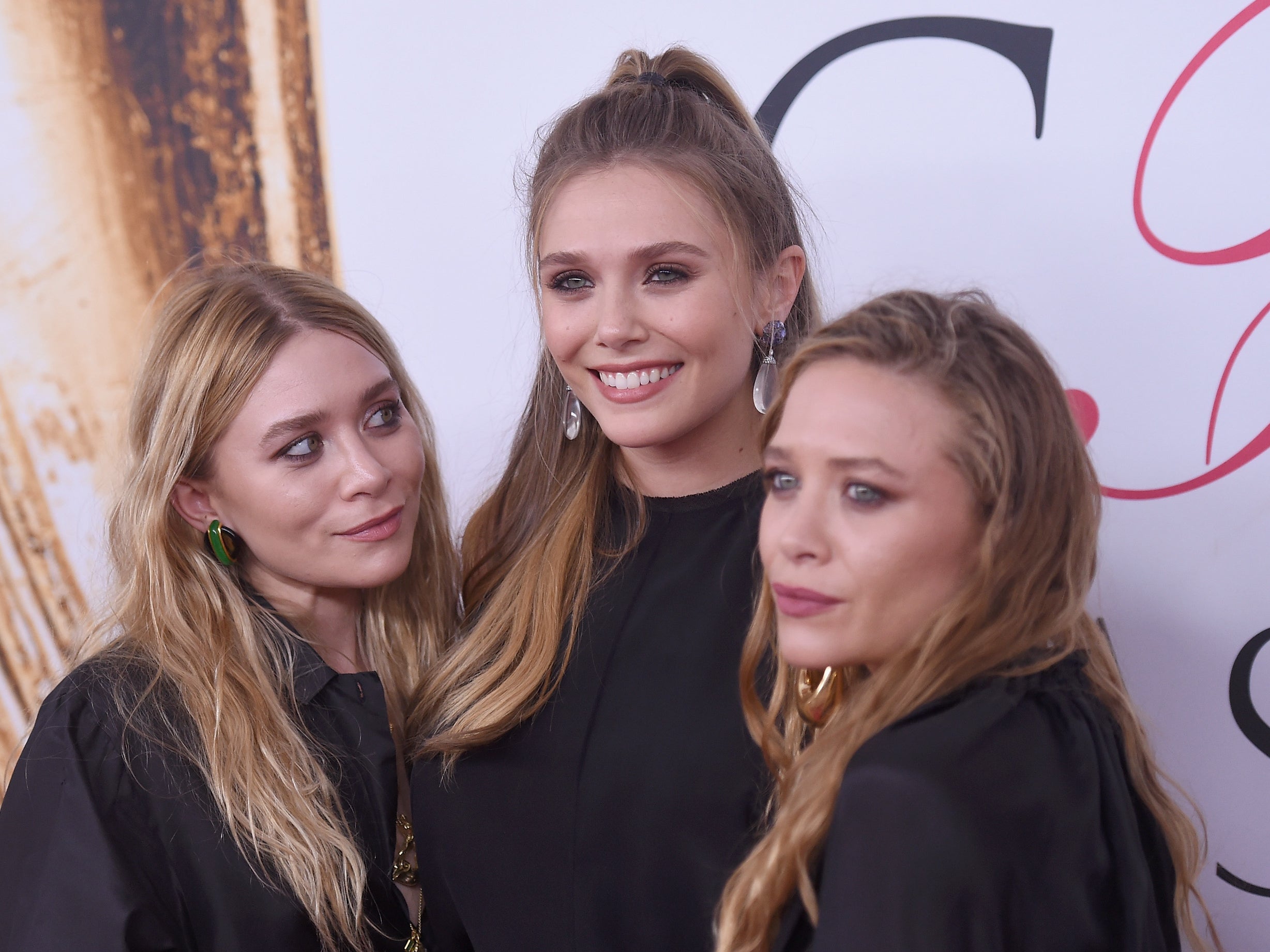 ‘I could only benefit from their healthy perspective’: Olsen with her sisters Mary-Kate and Ashley