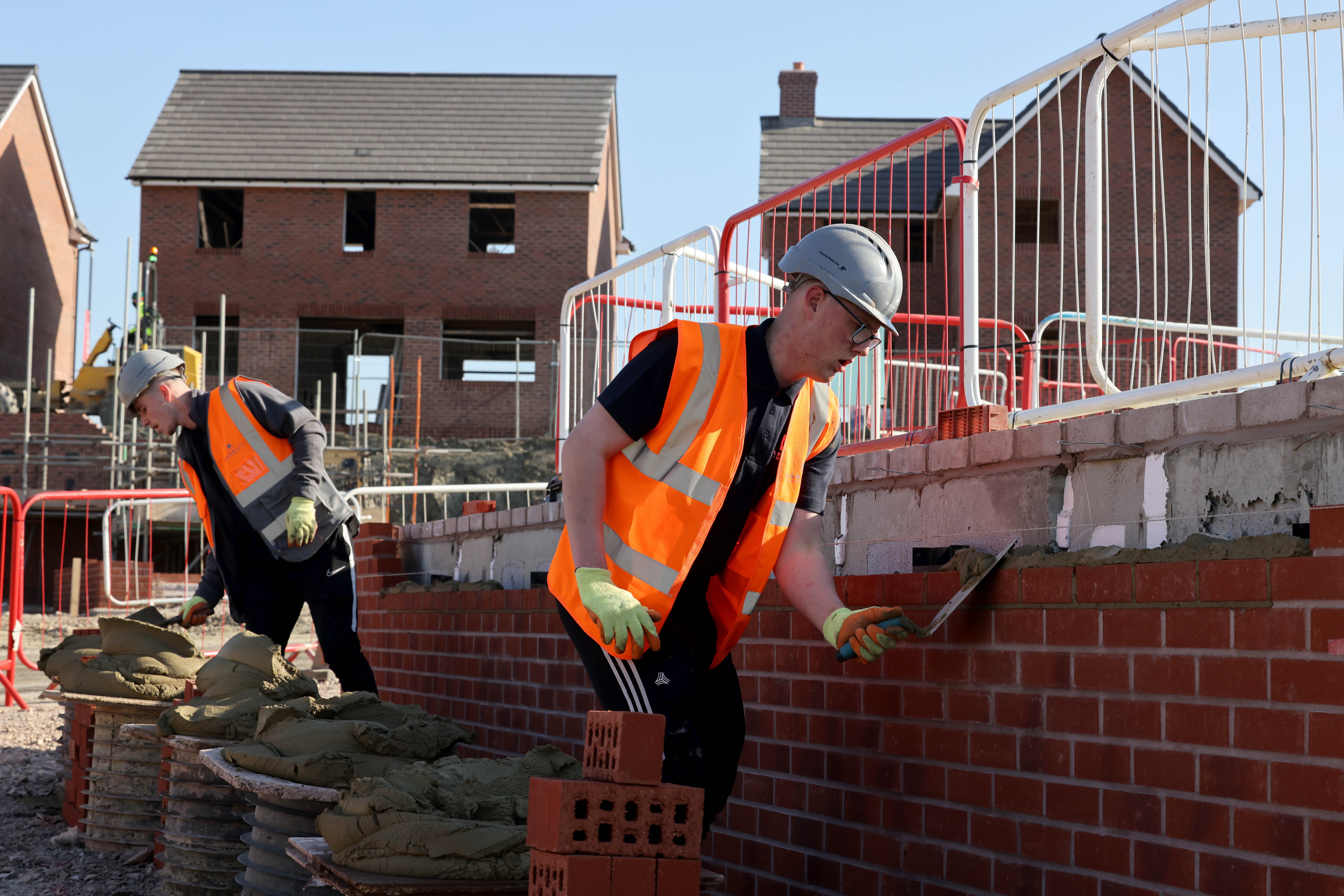 Bricklayers at work on a Barratt Homes development site (Jonathan Buckmaster/Daily Express/PA)