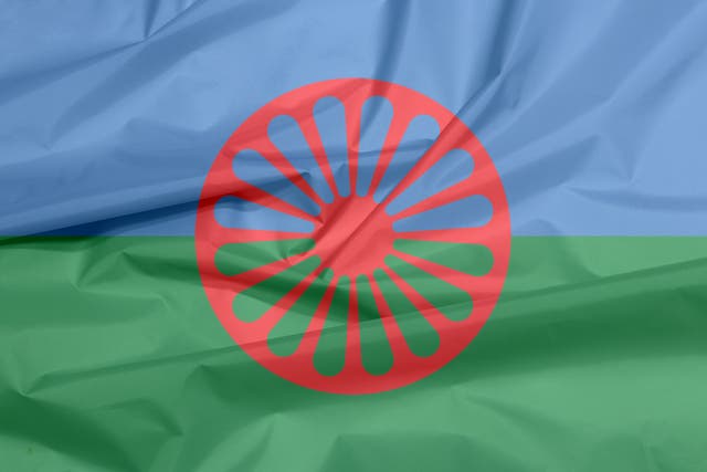 <p>Romani communities (whose flag is shown here) have been in the UK since the 15th century </p>