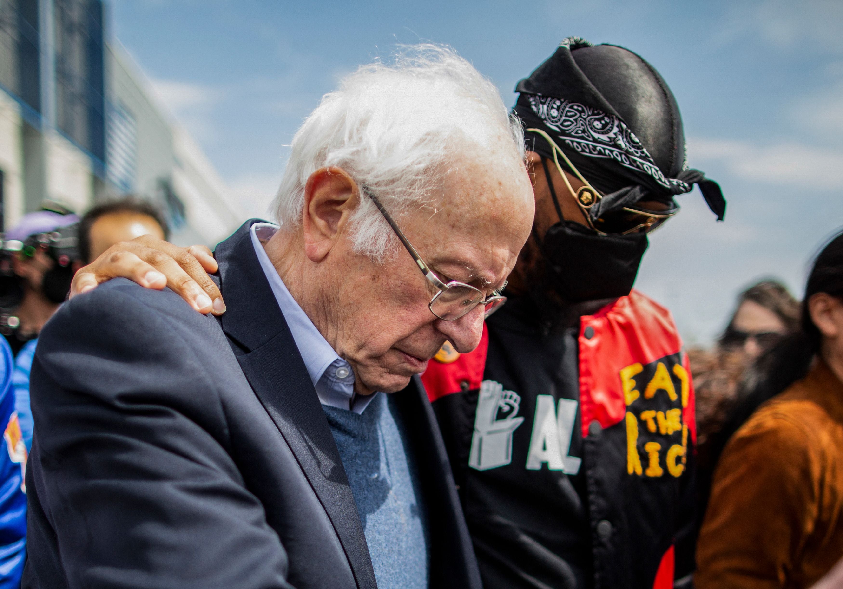 In this file photo taken on April 24, 2022, US Senator Bernie Sanders walks next to Amazon Labor Union leader Christian Smalls (R) during a rally outside the company building in Staten Island, New York City