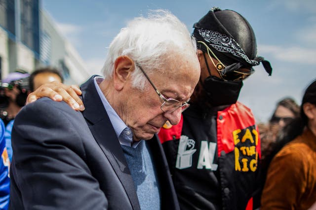 <p>In this file photo taken on April 24, 2022, US Senator Bernie Sanders walks next to Amazon Labor Union leader Christian Smalls (R) during a rally outside the company building in Staten Island, New York City </p>