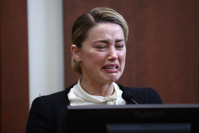 Amber Heard bursts into tears as she recalls an alleged violation by Johnny Depp (Jim Lo Scalzo/AP)