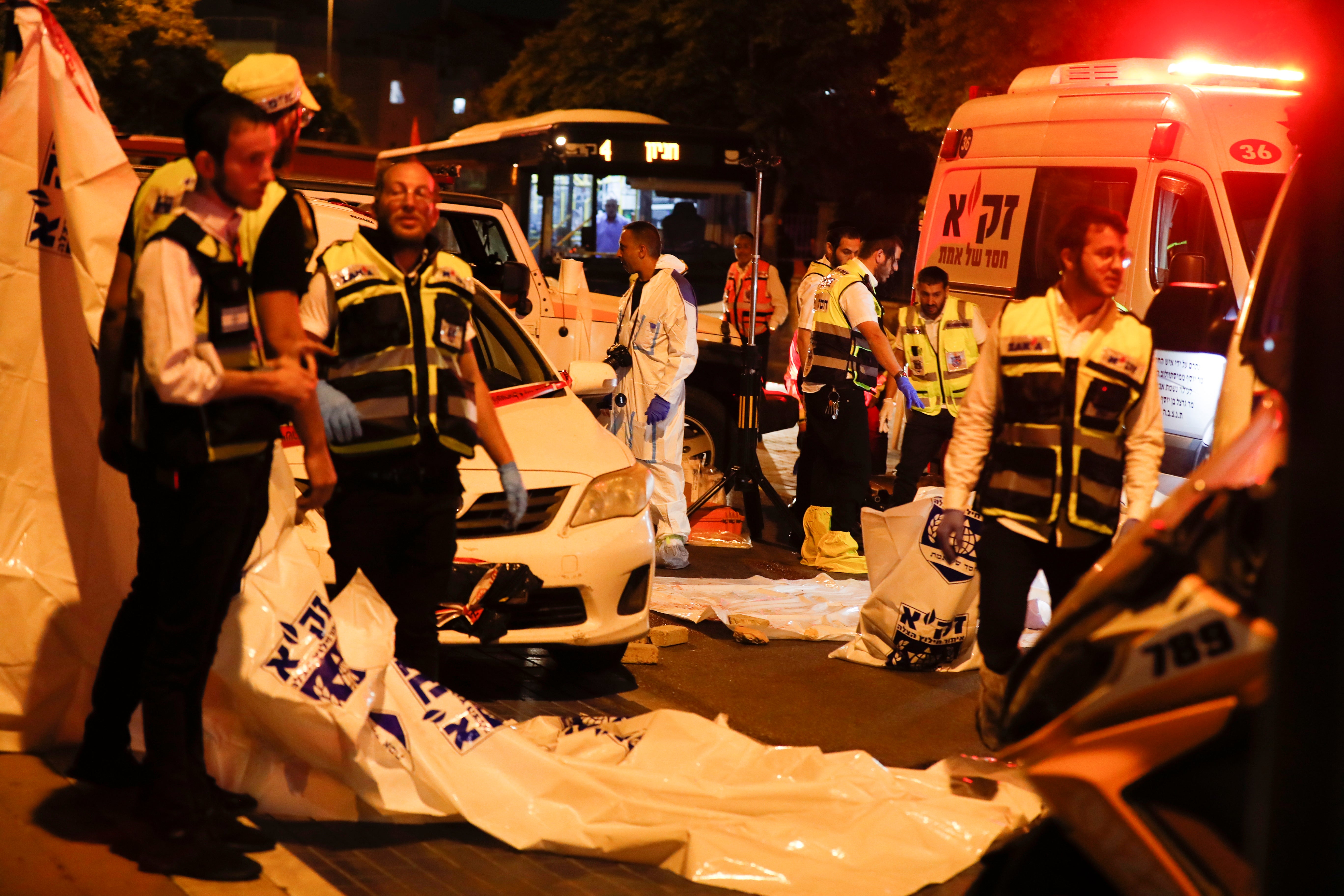 Israeli medics at the scene of a stabbing attack in the ultra-Orthodox city of Elad