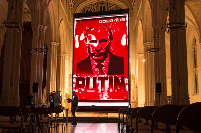 <p>Molodkin’s sculpture is projected on to a church wall in central London </p>