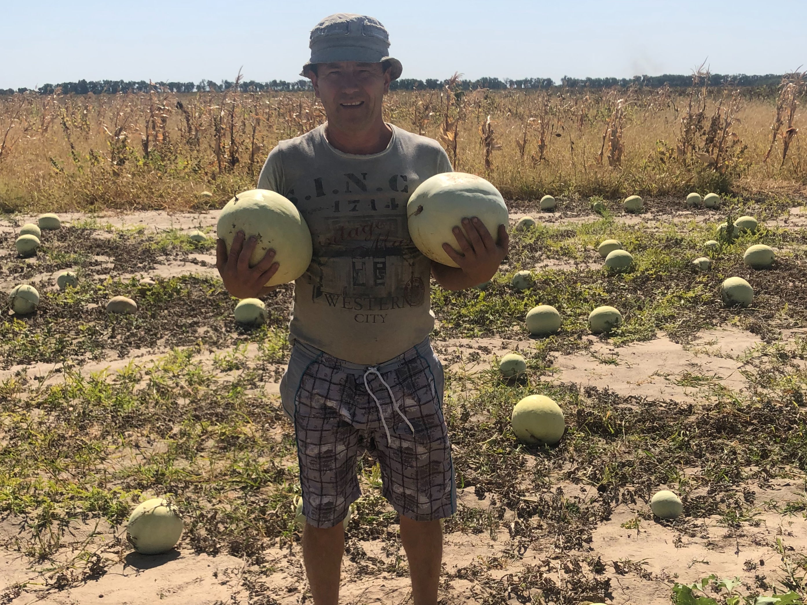 Igor Kurayan holds some of his watermelons