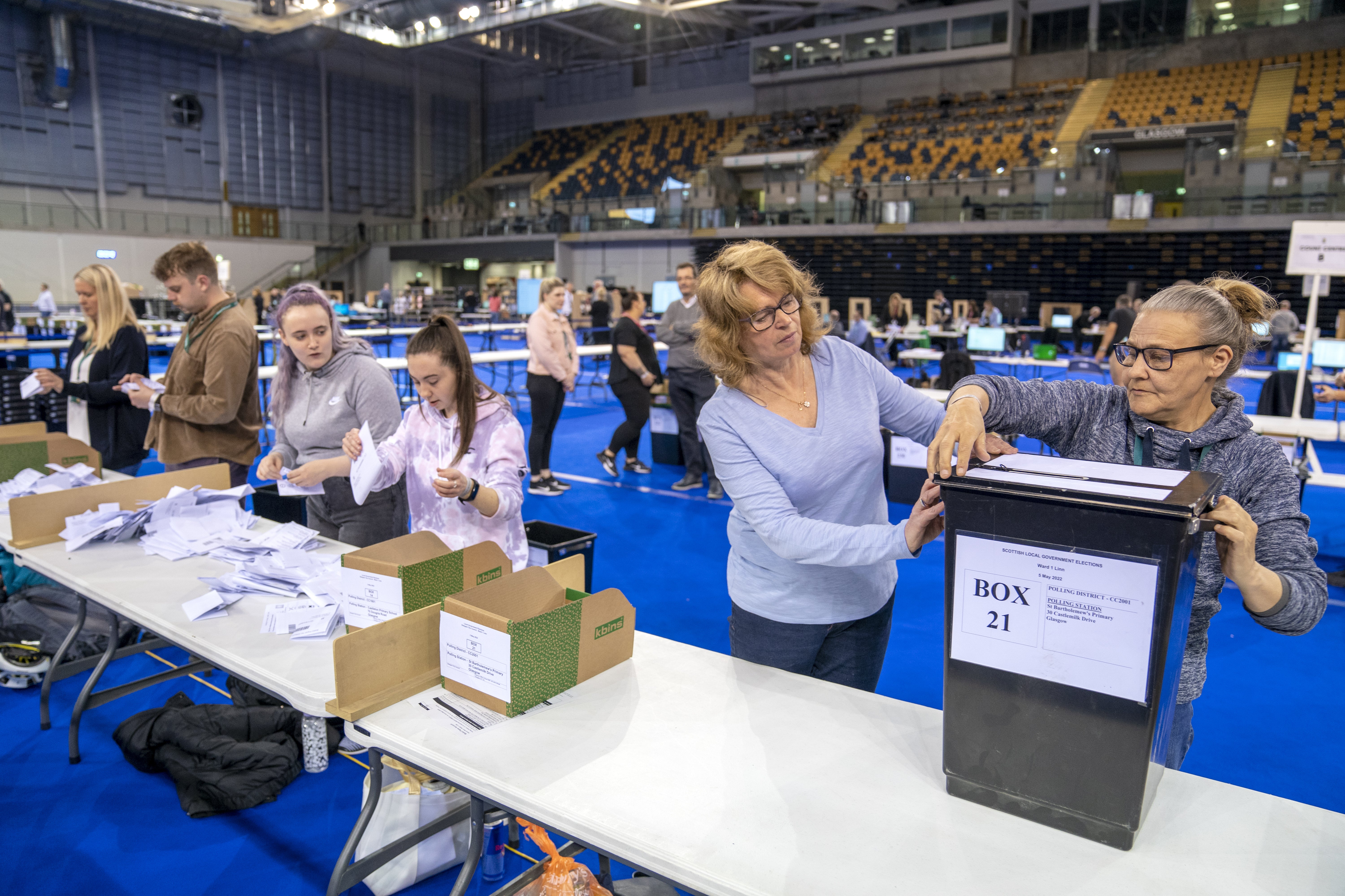 Ballot boxes are opened ready for sorting at the Glasgow City Council count at the Emirates Arena (Jane Barlow/PA)