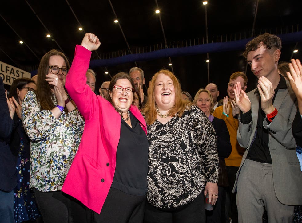 Kellie Armstrong celebrates with party leader Naomi Long (Liam McBurney/PA)