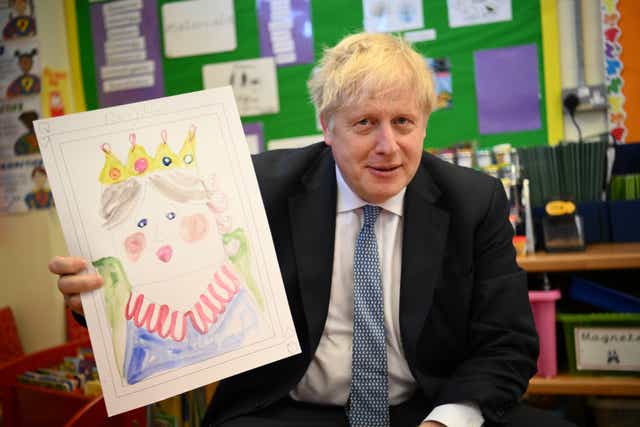 Prime Minister Boris Johnson with the portrait he painted of the Queen during a drawing session with children at Field End Infant School in his Uxbridge and South Ruislip constituency (Daniel Leal/PA)