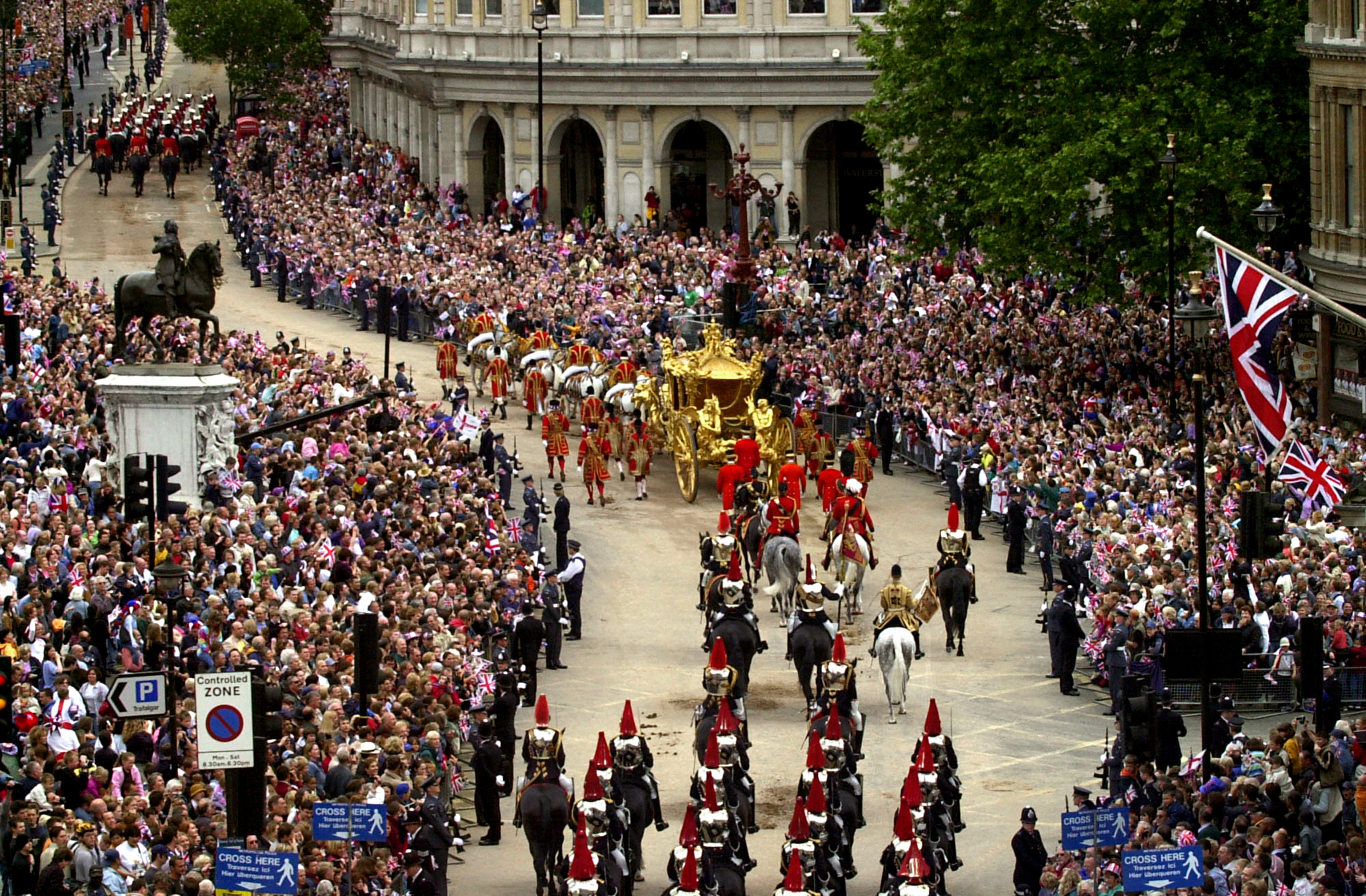 Crowds lining the street as the Queen rides in the Gold State Coach from Buckingham Palace to St Paul’s Cathedral (Barry Batchelor/PA)