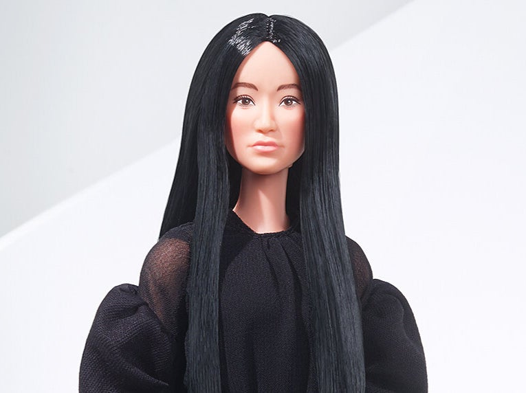 The doll is complete with Wang’s sleek black hair and dark fashion.