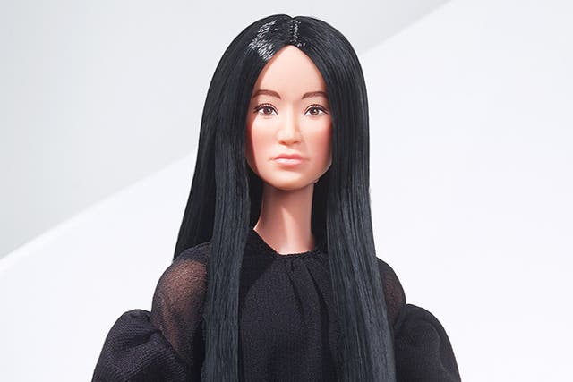 <p>The doll is complete with Wang’s sleek black hair and dark fashion. </p>