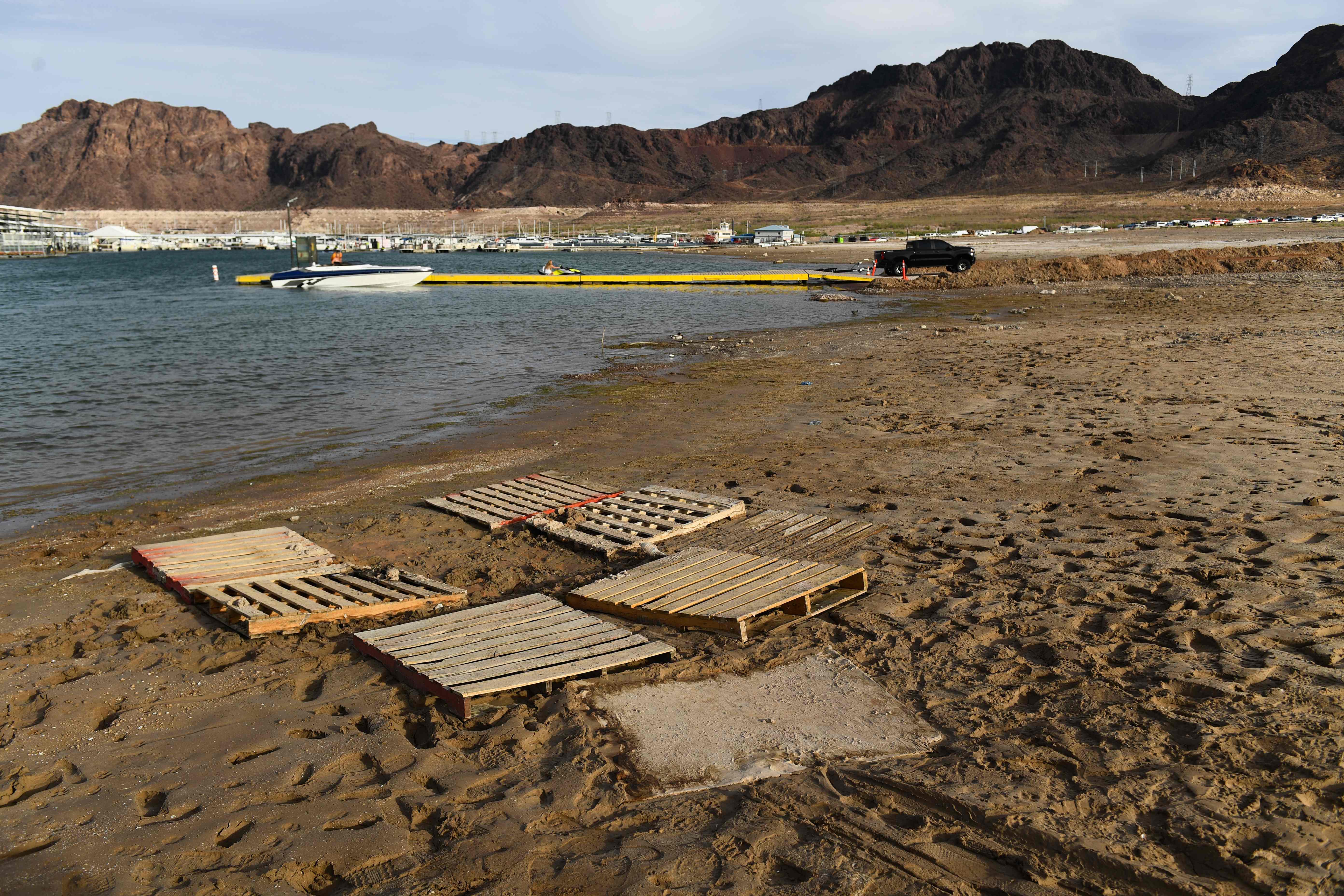 Pallets note where human remains were recently found on the shore of Lake Mead as the water level drops to unprecedented lows, a result of years-long drought
