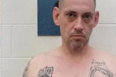 Police share new images of Alabama murder inmate on the run with corrections officer, revealing his Nazi tattoos