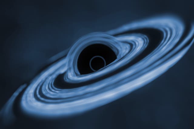 <p>An artist’s conception of matter swirling into a black hole</p>