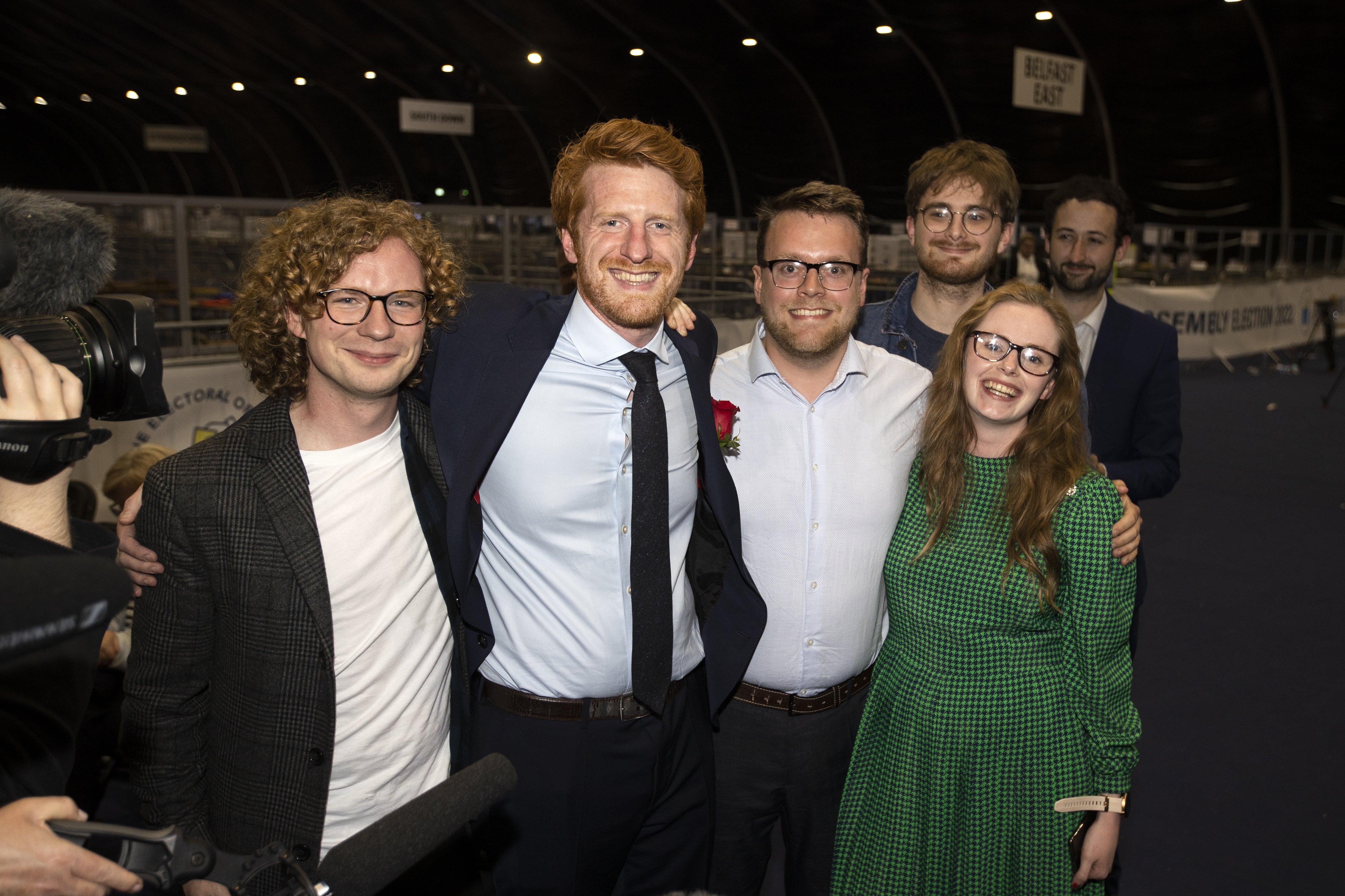 The SDLP’s Matthew O’Toole (second left) celebrates with his election team after being newly elected as an MLA (Liam McBurney/PA)