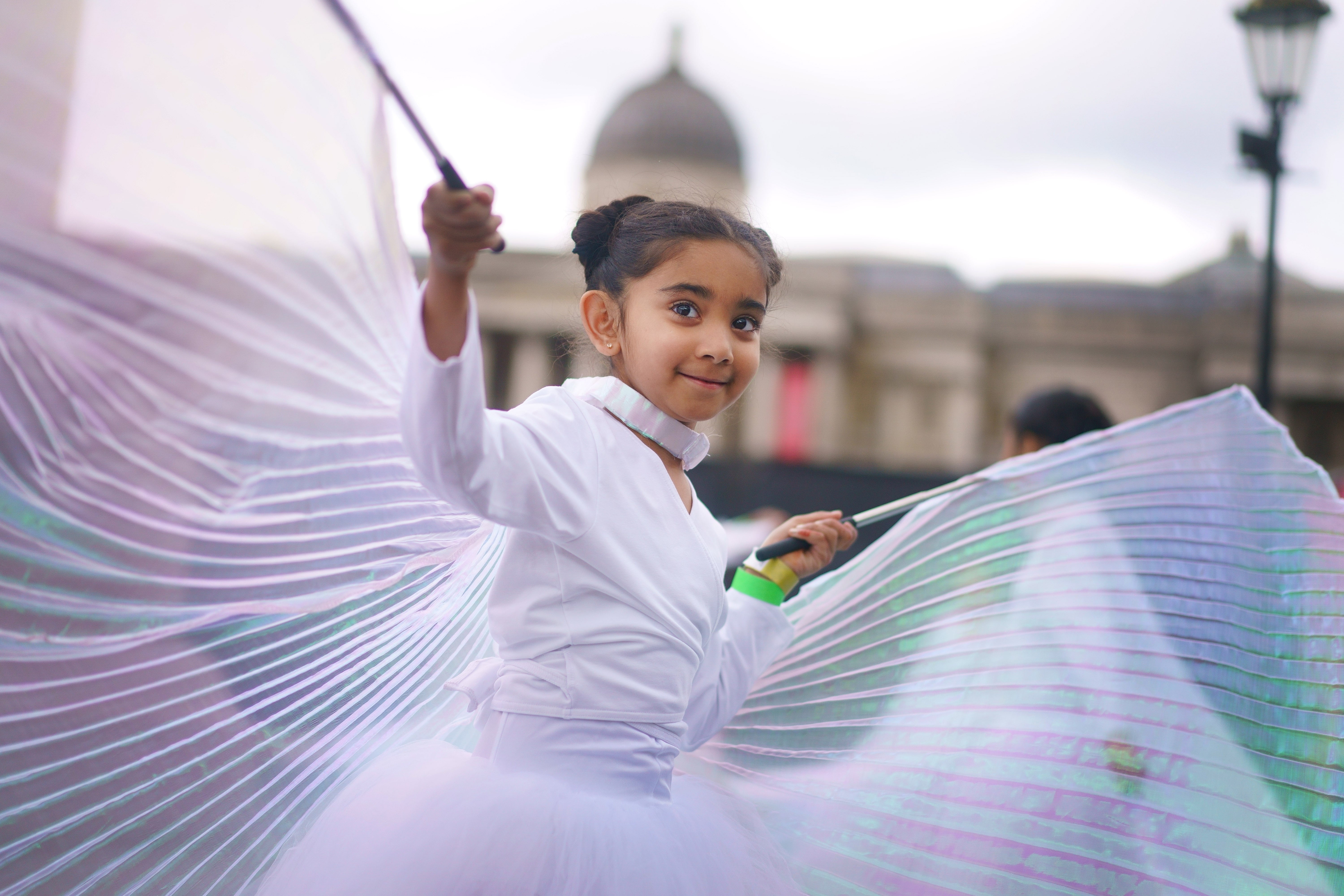 A girl from Grace and Poise, the world’s first Muslim ballet school, performs during the Eid in the Square festival in Trafalgar Square (Victoria Jones/PA)