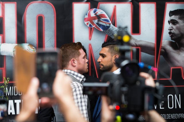 Saul Alvarez (left) and Amir Khan (right) during a press conference ahead of their world title fight (John Walton/PA)