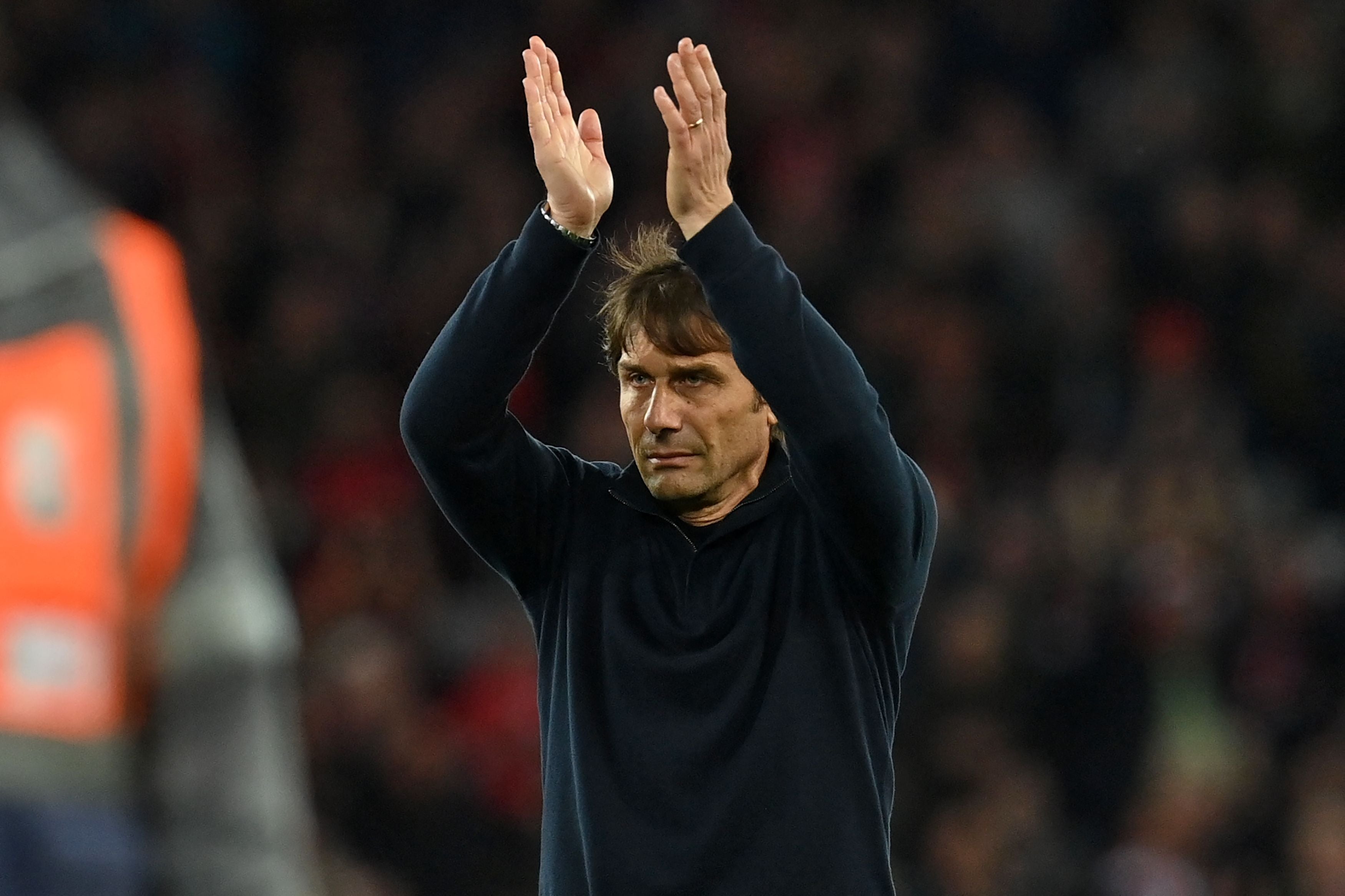 Antonio Conte applauds Tottenham’s supporters at Anfield on Saturday