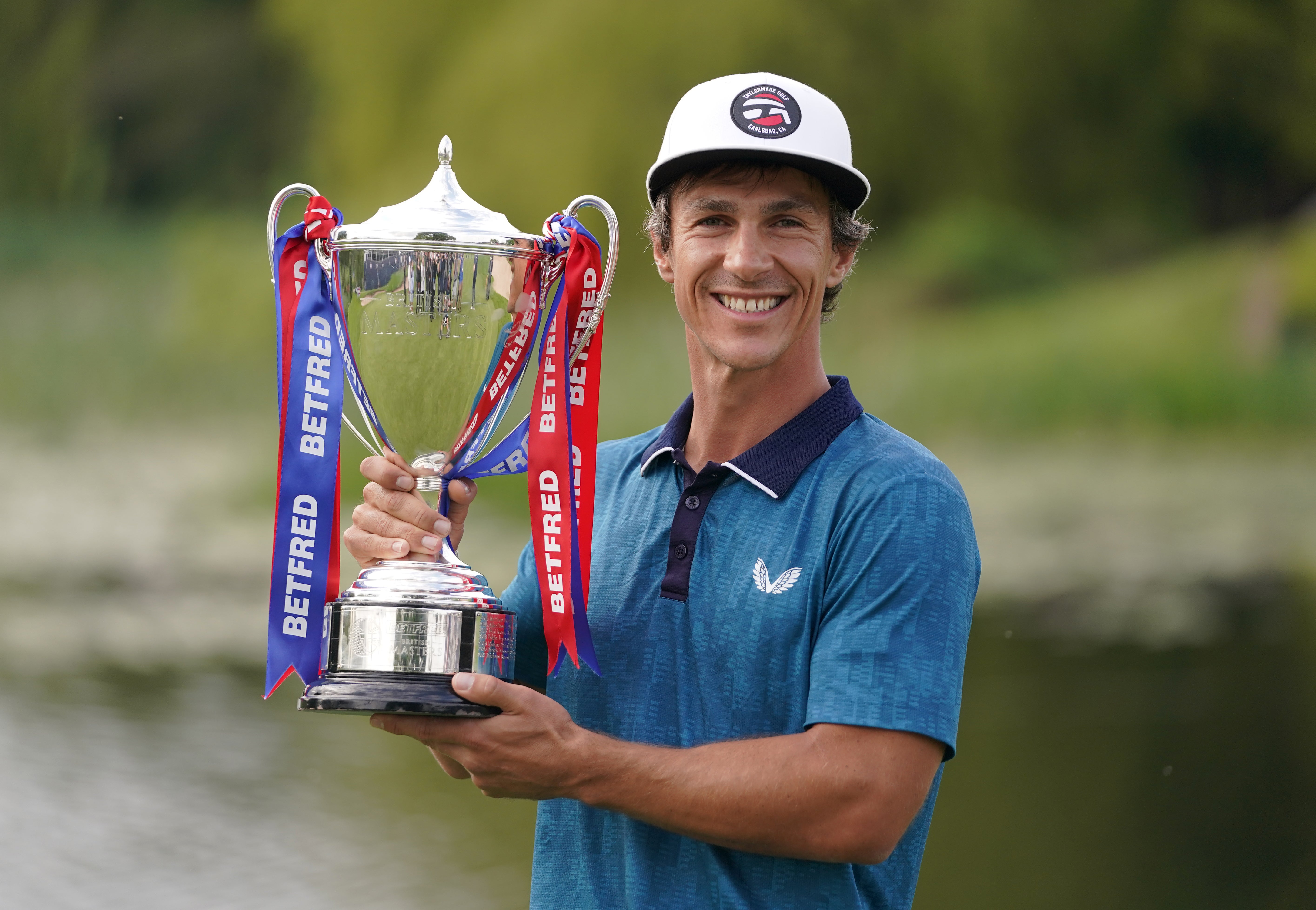 Denmark’s Thorbjorn Olesen celebrates with the trophy after winning the Betfred British Masters (Zac Goodwin/PA)