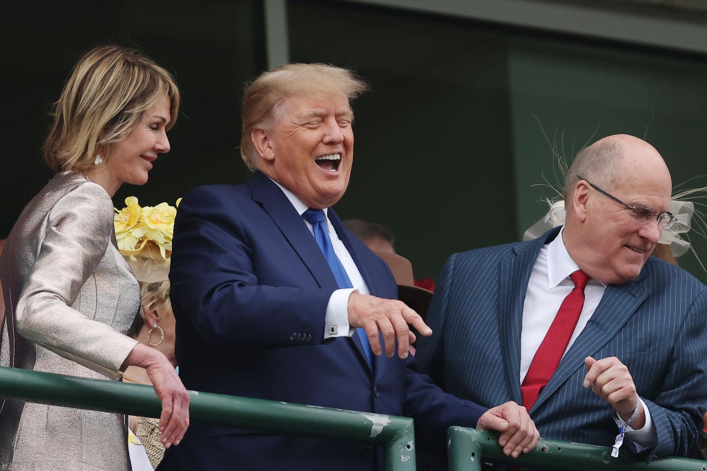 Donald Trump laughs while attending the 2022 Kentucky Derby in Louisville, Ky