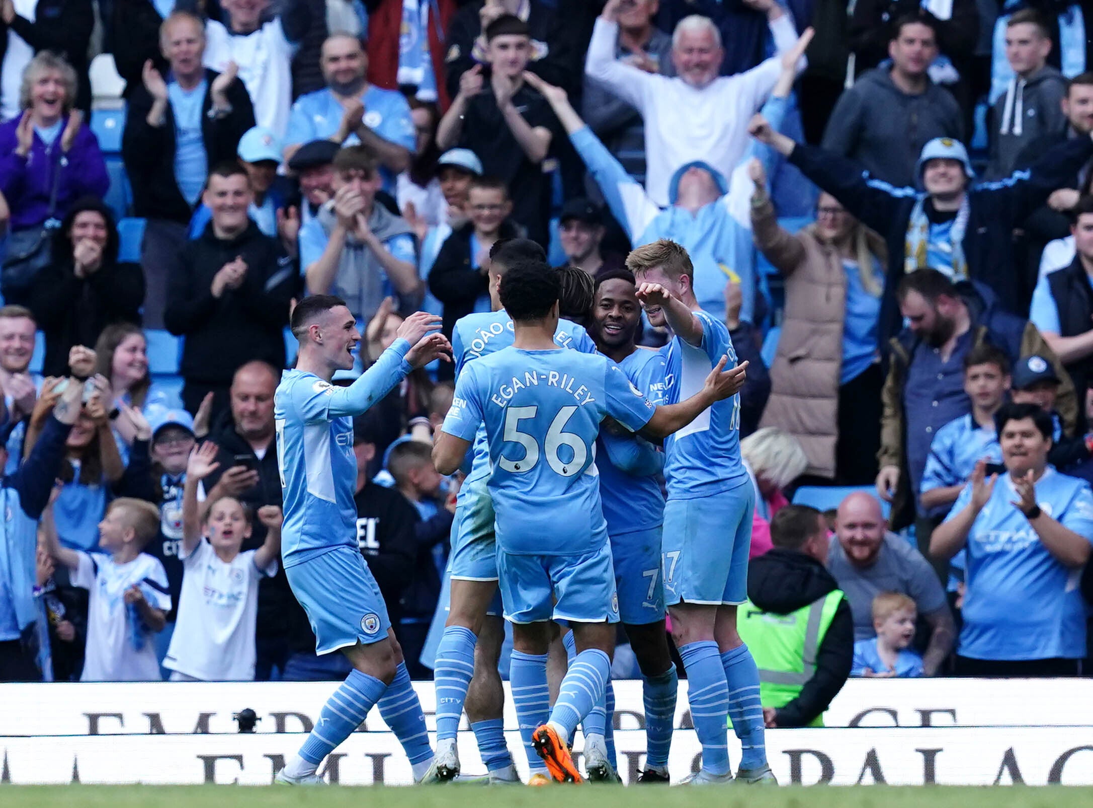 Raheem Sterling, second right, celebrates with his team-mates after scoring Manchester City’s fifth goal against Newcastle (Martin Rickett/PA)