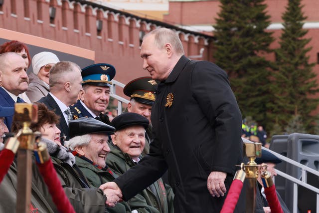 <p>Putin shakes hands with veterans prior to the Victory Day military parade</p>