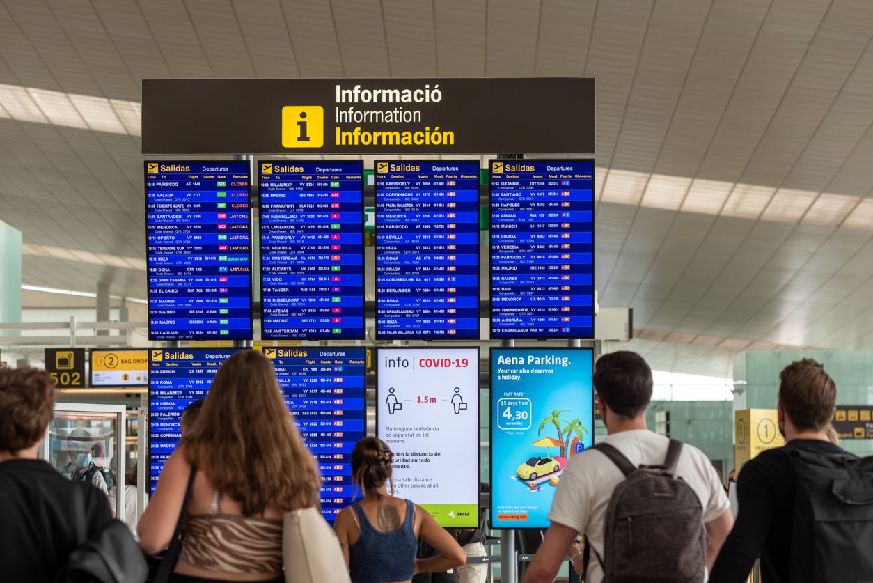 <p>Holidaymakers waiting at Barcelona El Prat airport</p>