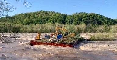 Two barges stuck along Potomac River after heavy rain caused them to break free and float away