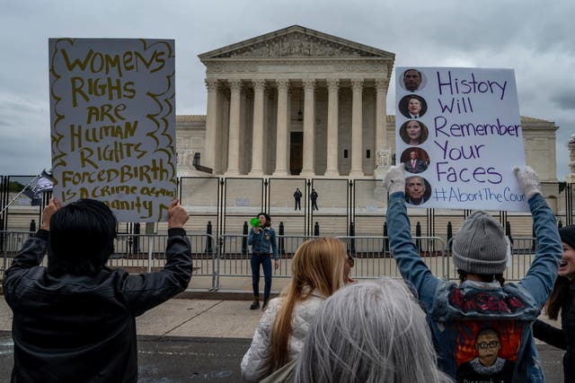 <p>Protesters outside the US Supreme Court on Sunday</p>
