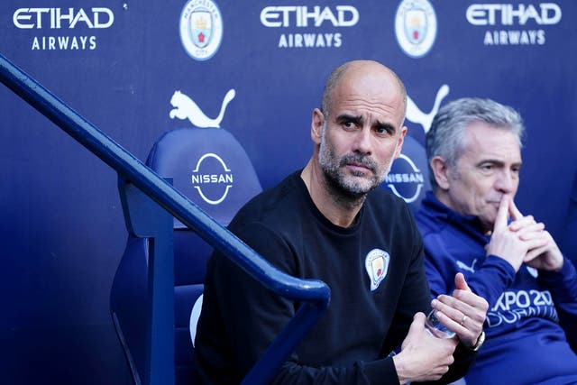 <p>Pep Guardiola is on track for another Premier League title (Martin Rickett/PA)</p>