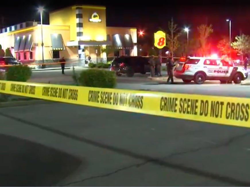 The scene outside of a New York Buffalo Wild Wings where an off-duty NYPD police officer allegedly killed himself and another man. Investigators believe the shooting was over a woman both men were romantically pursuing.