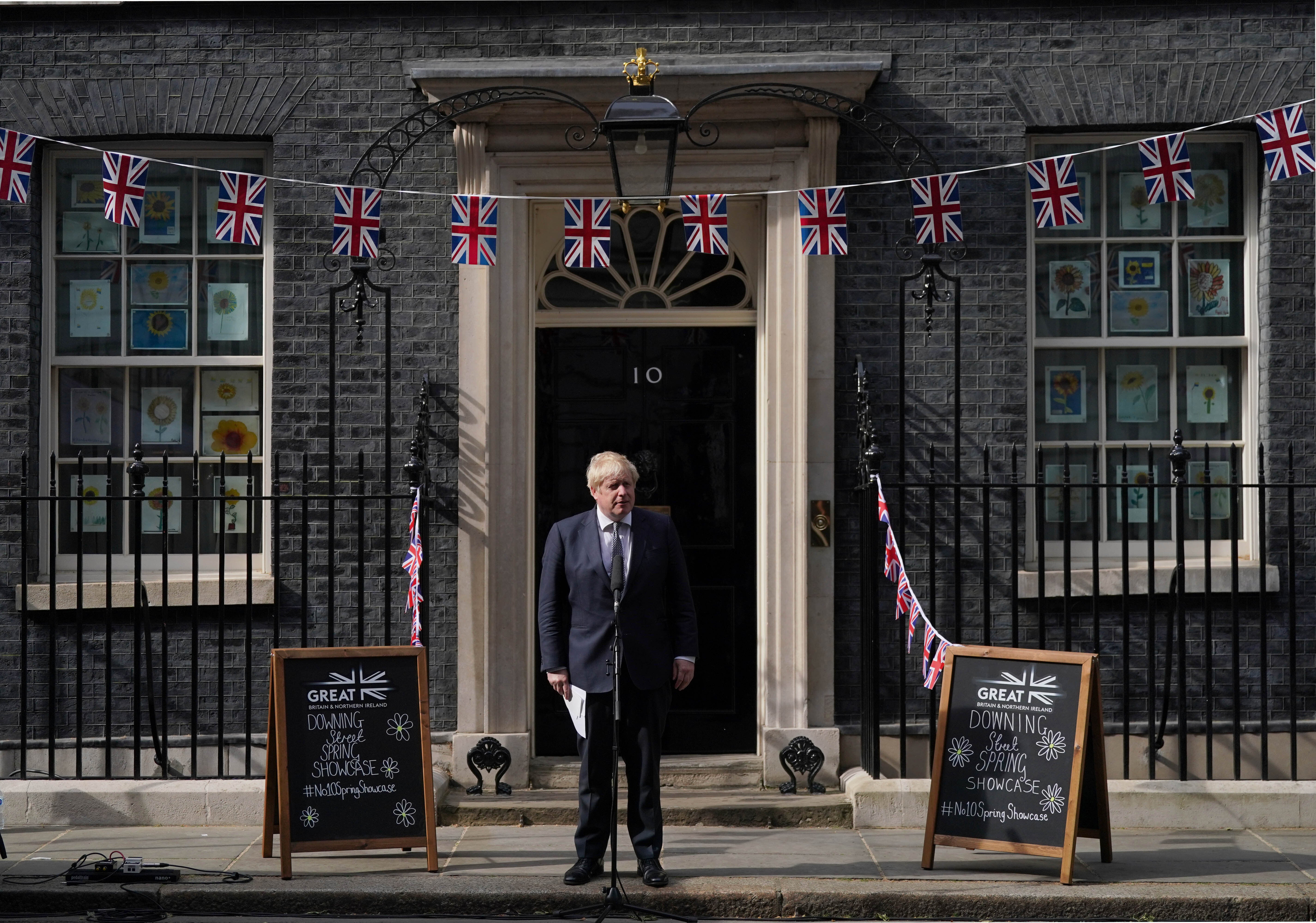 Prime Minister Boris Johnson speaks with stallholders (Victoria Jones/PA)