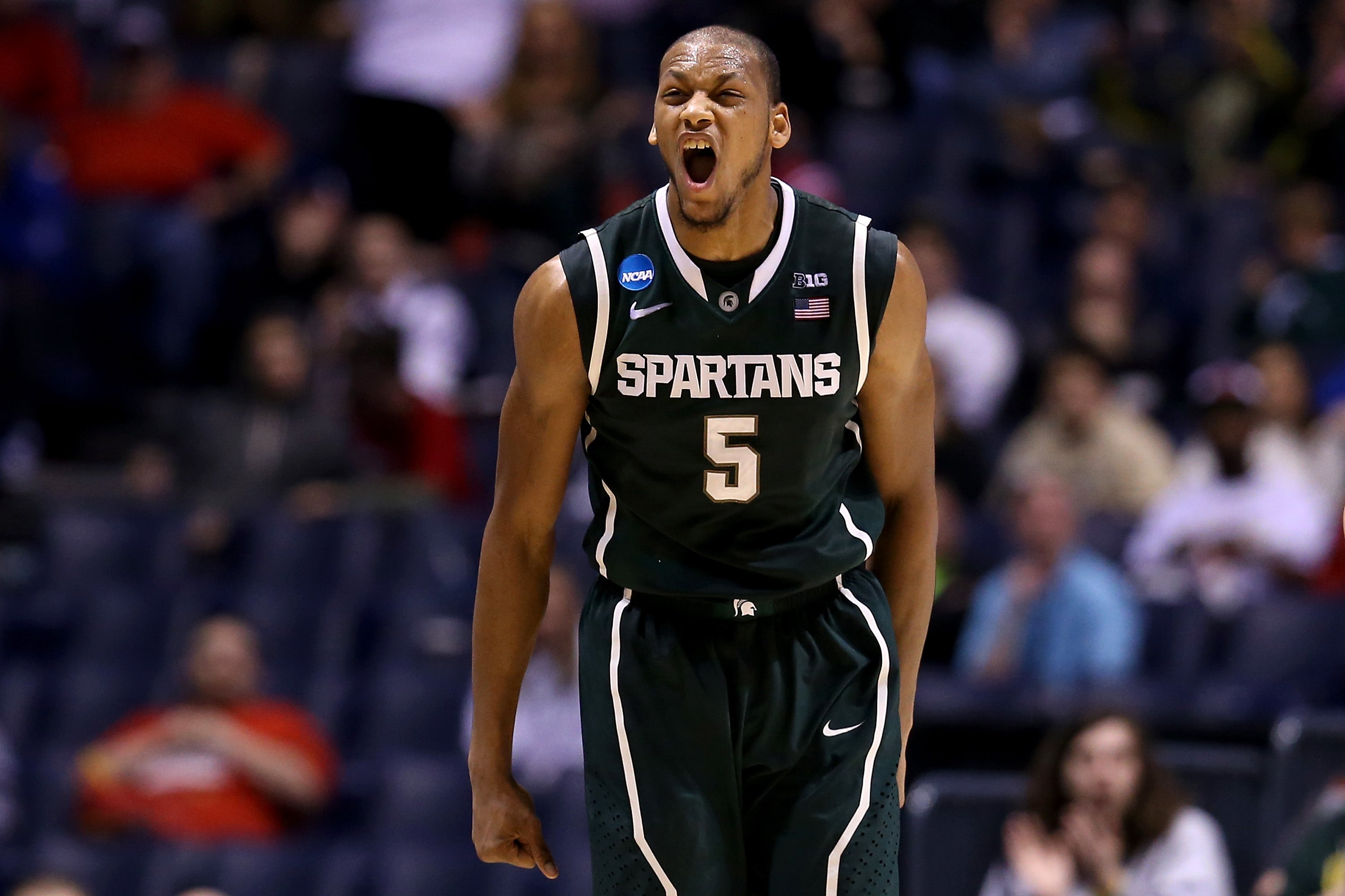 Adreian Payne #5 of the Michigan State Spartans reacts after he made a shot in the first half against the Duke Blue Devils during the Midwest Region Semifinal round of the 2013 NCAA Men's Basketball Tournament