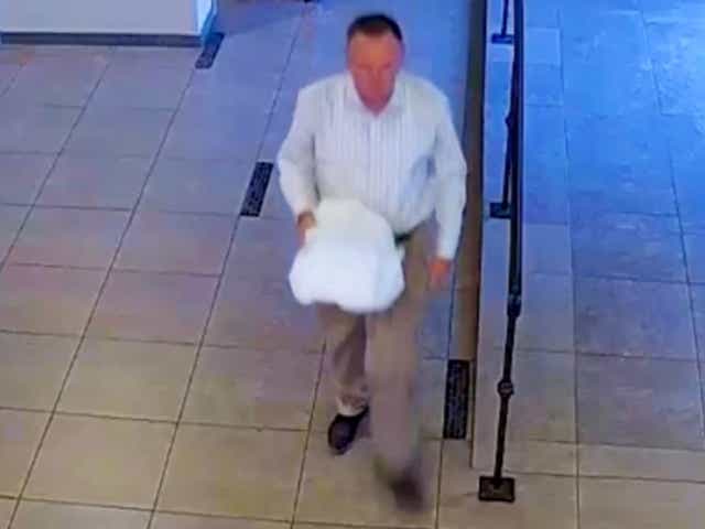 <p>Surveillance footage from a Chandler, Arizona, wedding showing a man police believe to be former Pinal County Sheriff’s Deputy Landon Earl Rankin, 54, stealing a box of wedding cards containing between $3,000 and $6,000.</p>