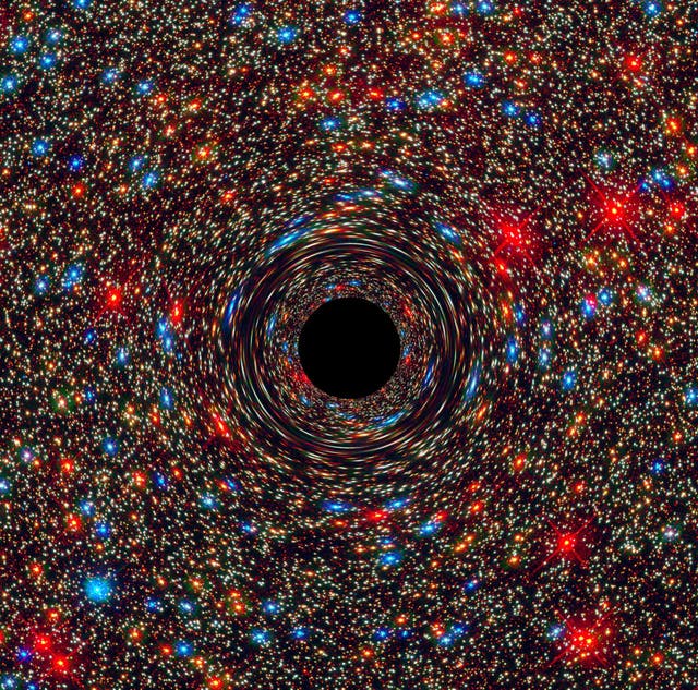 <p>A computer simulation of a supermassive black hole at the center of a galaxy</p>