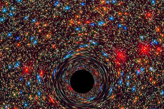 <p>A computer simulation of a supermassive black hole at the center of a galaxy</p>