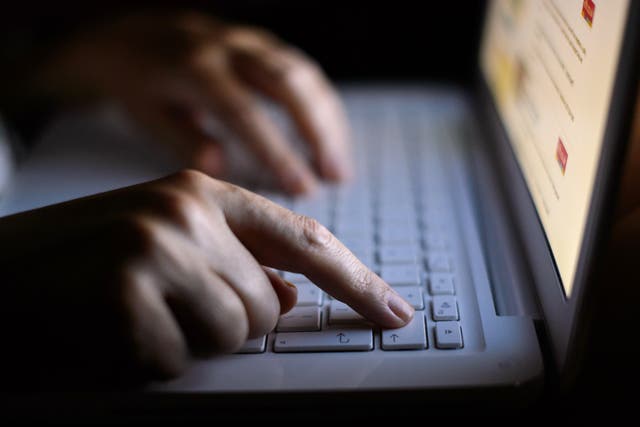 A record 2.7m online scams were taken down last year by the National Cyber Security Centre (Dominic Lipinski/PA)