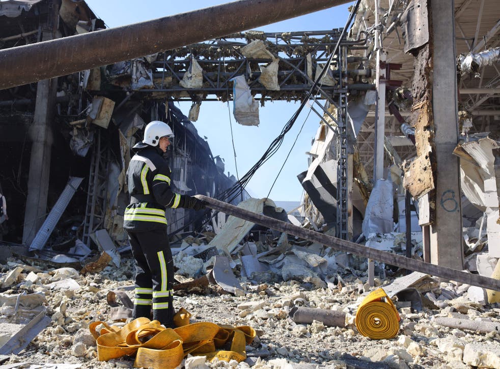 <p>First responders try to clear rubble in the Odesa region</p>