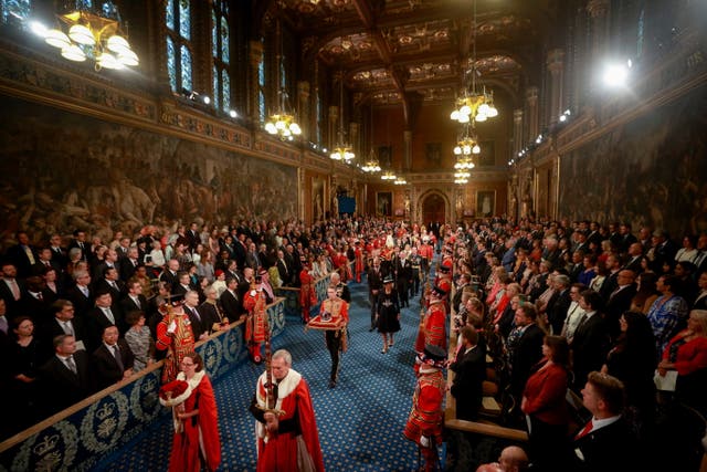 <p>The Prince of Wales and the Duchess of Cornwall with the Duke of Cambridge proceed behind the Imperial State Crown through the Royal Gallery during the state opening of parliament in the House of Lords</p>