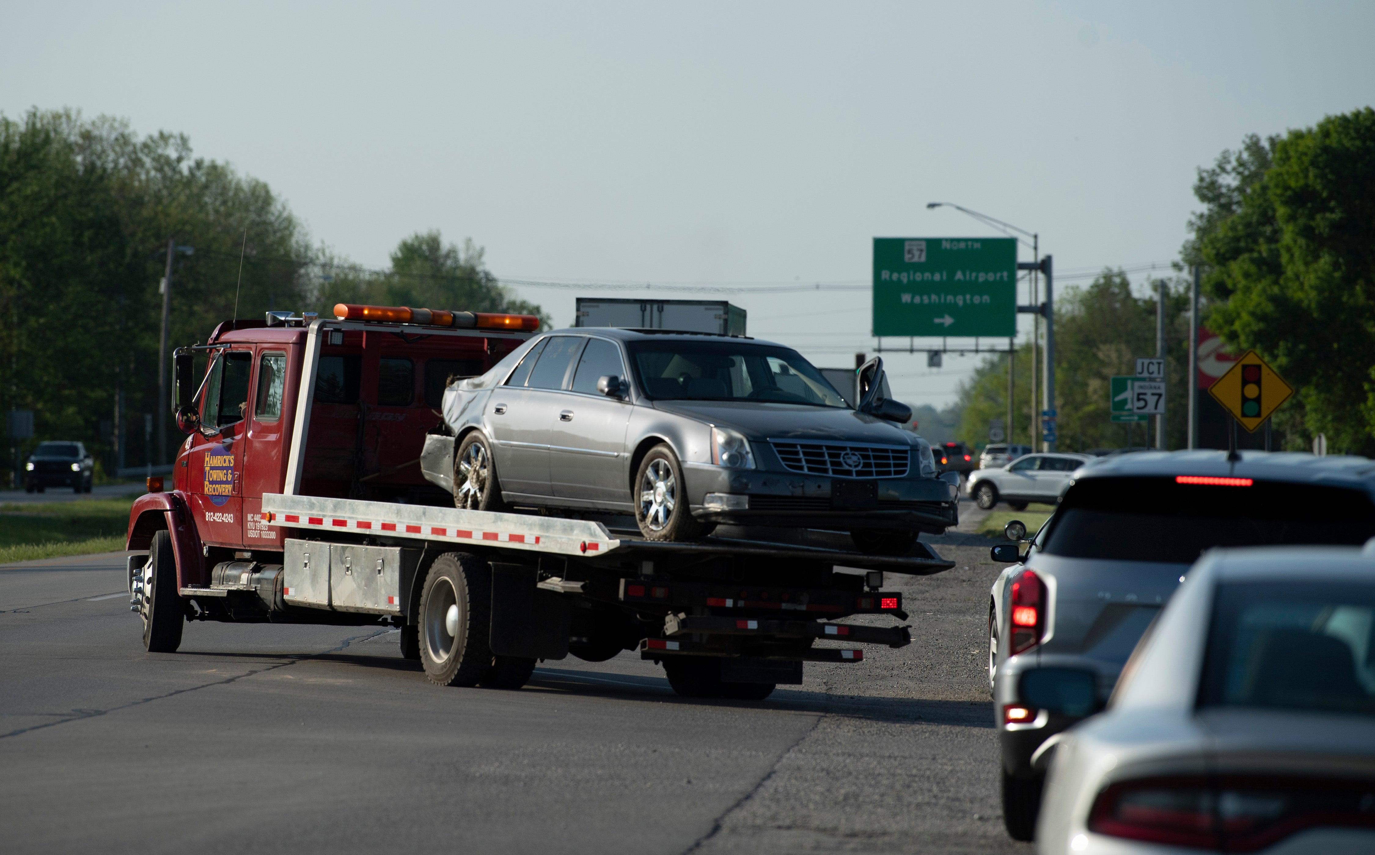 The Cadillac driven by the fugitives is towed away on Monday