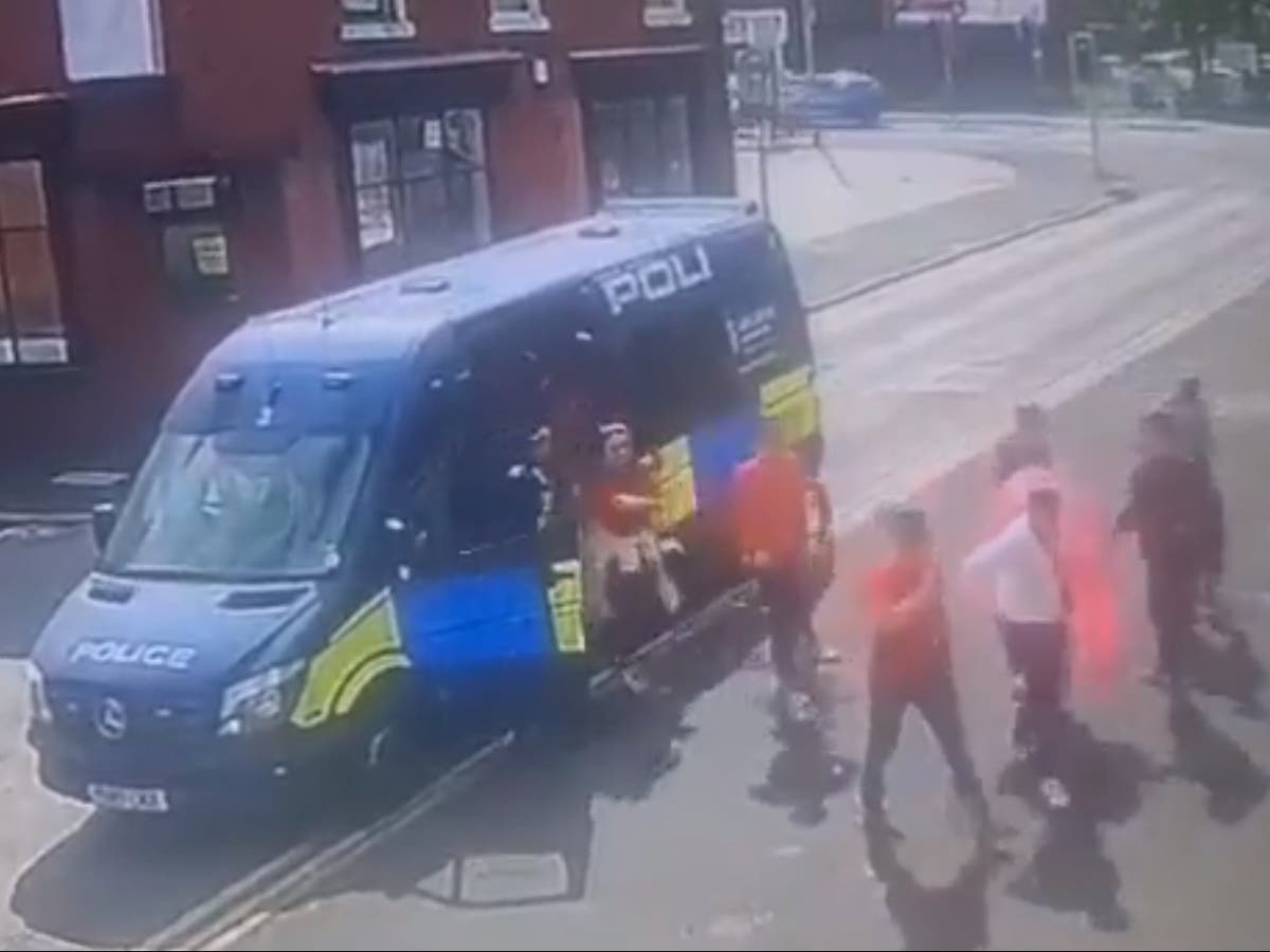 Police force launches probe after football fans given lift to pub in back of riot van Police force launches probe after football fans given lift to pub in back of riot van