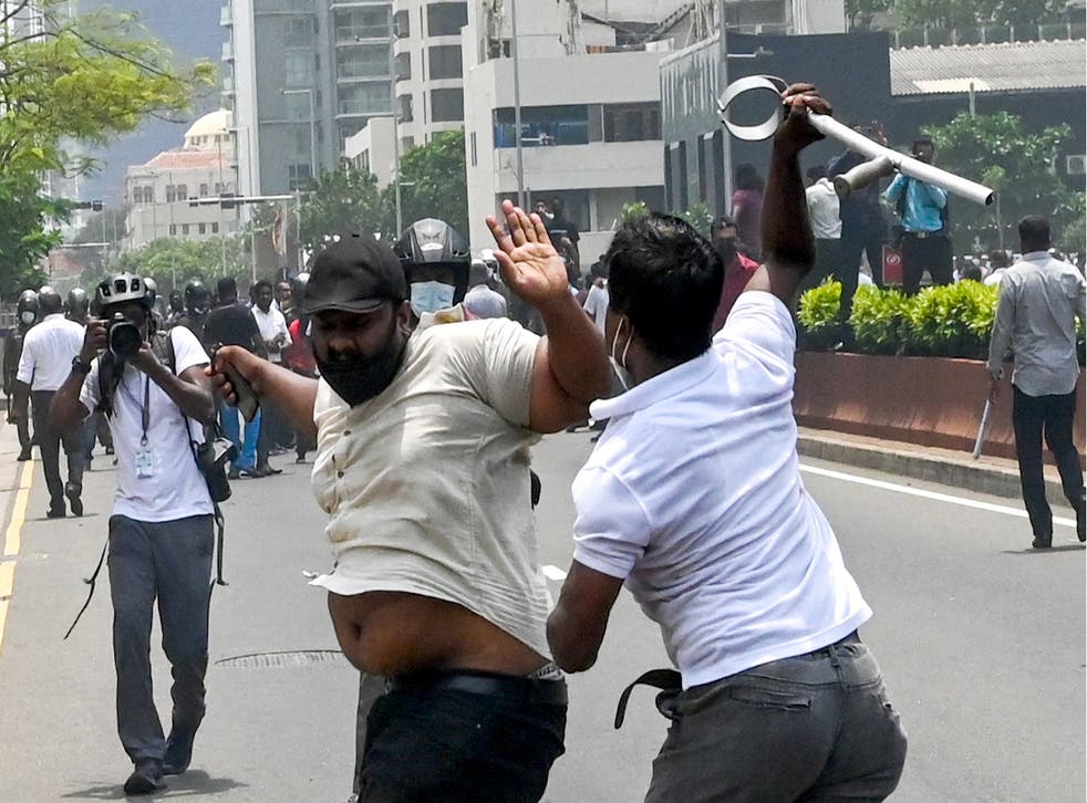 <p>Demonstrators and government supporters clash outside the prime minister’s official residence in Colombo on Monday </p>