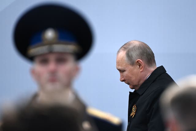 <p>Russian President Vladimir Putin arrives to watch the Victory Day military parade at Red Square in central Moscow on May 9, 2022</p>
