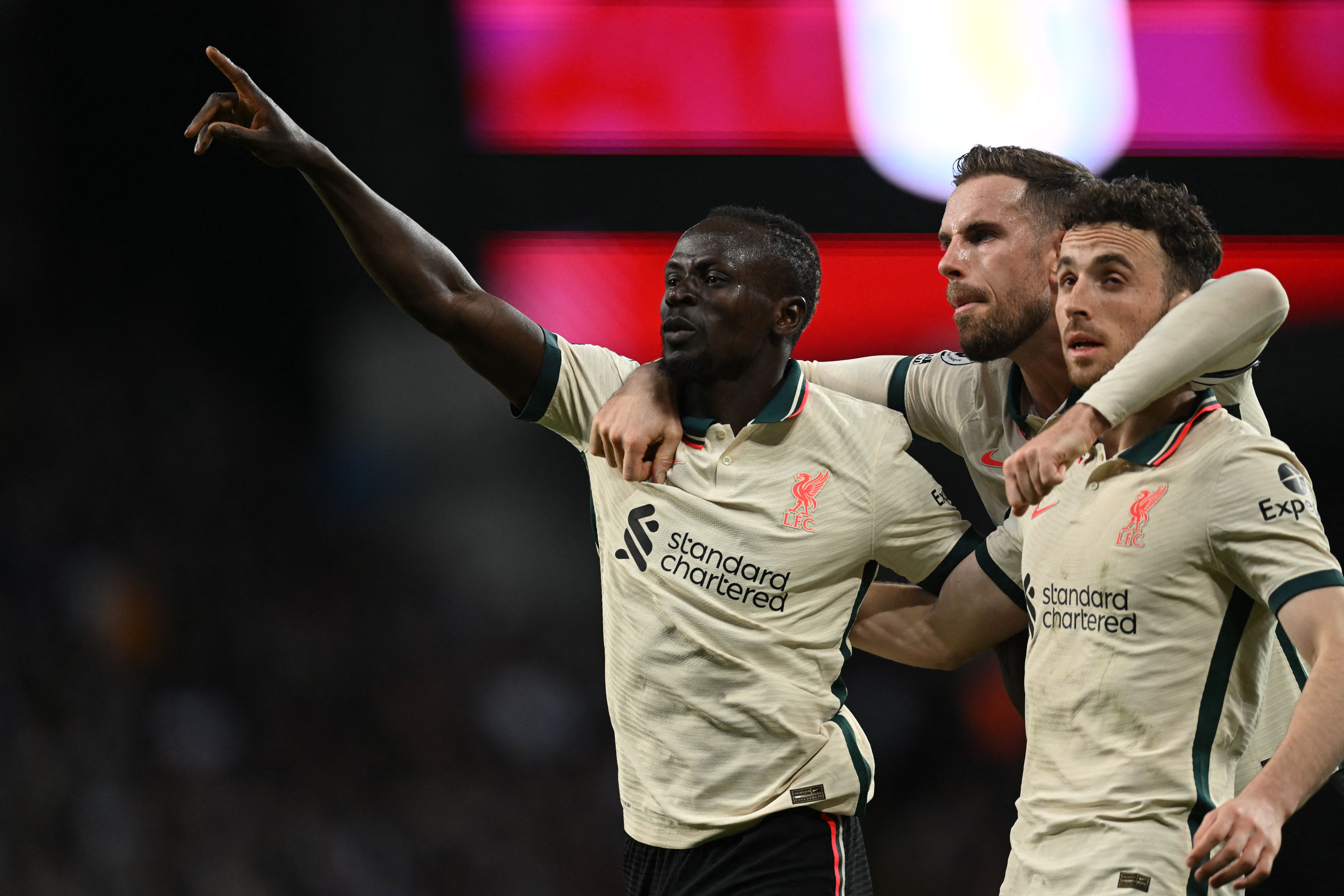 Staying alive: Mane (left) scored the second goal to ensure Livepool were still title contenders